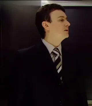 Lift Passenger in Suit