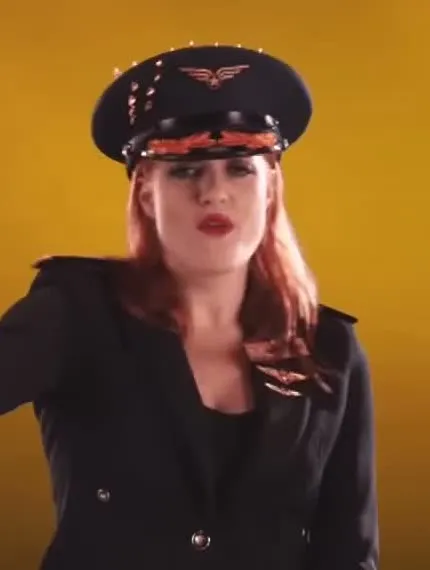 Caroline Hjelt as a pilot in Dongs All Over The World (Saturday Night Live, 2014).