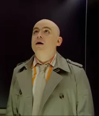 Lift Passenger in Trench Coat